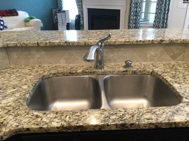 interior details with sink and decorative backsplash