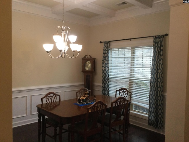 dining space with beamed ceiling, crown molding, coffered ceiling, and an inviting chandelier