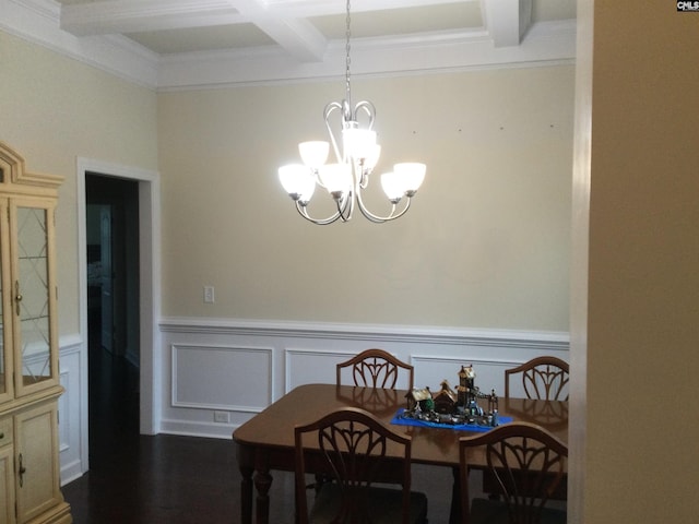 dining space with beamed ceiling, coffered ceiling, hardwood / wood-style flooring, and a notable chandelier