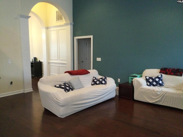 living room featuring dark wood-type flooring