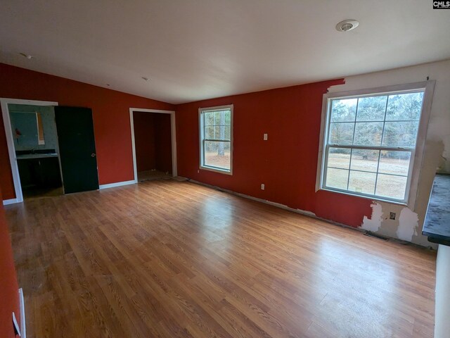 1357 Old English Rd, Lugoff, SC 29078 - unfurnished living room featuring lofted ceiling and light wood-type flooring