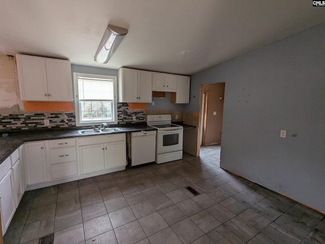 kitchen with tasteful backsplash, white cabinetry, sink, and white appliances