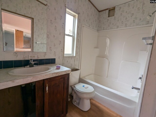 1357 Old English Rd, Lugoff, SC 29078 - full bathroom with vanity, crown molding, toilet, shower / bathtub combination, and wood-type flooring