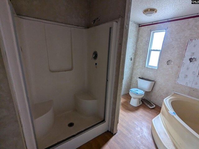 1357 Old English Rd, Lugoff, SC 29078 - bathroom featuring separate shower and tub, hardwood / wood-style floors, a textured ceiling, toilet, and ornamental molding