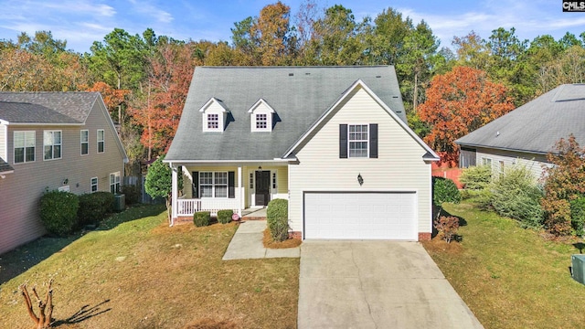 view of front of home with a porch, a garage, and a front lawn