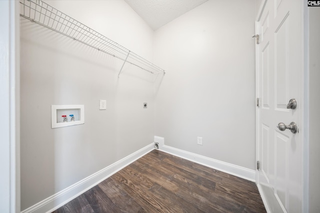 laundry area with a textured ceiling, electric dryer hookup, dark wood-type flooring, and hookup for a washing machine