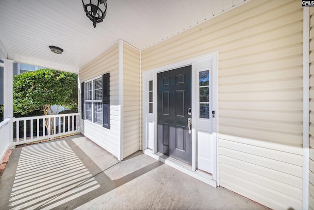 property entrance featuring covered porch