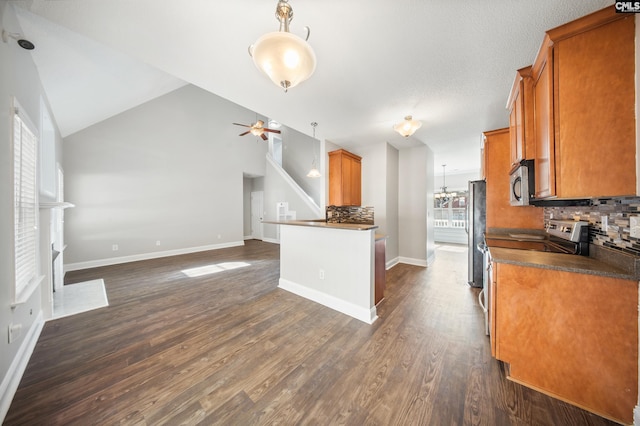 kitchen featuring decorative backsplash, appliances with stainless steel finishes, and a healthy amount of sunlight