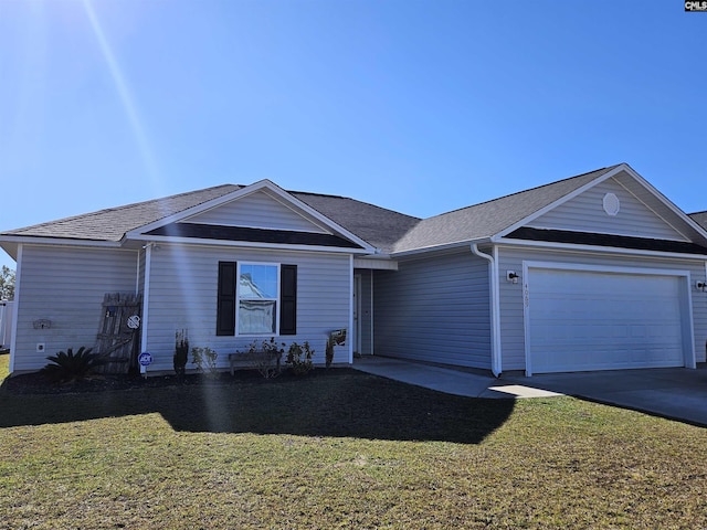 ranch-style house featuring a garage and a front yard