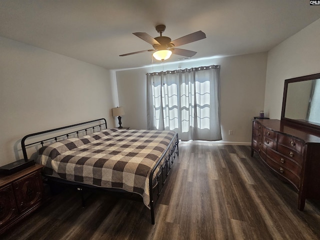 bedroom featuring ceiling fan and dark hardwood / wood-style flooring