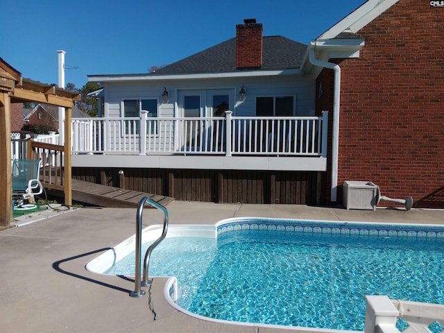 view of pool with a patio area and a deck