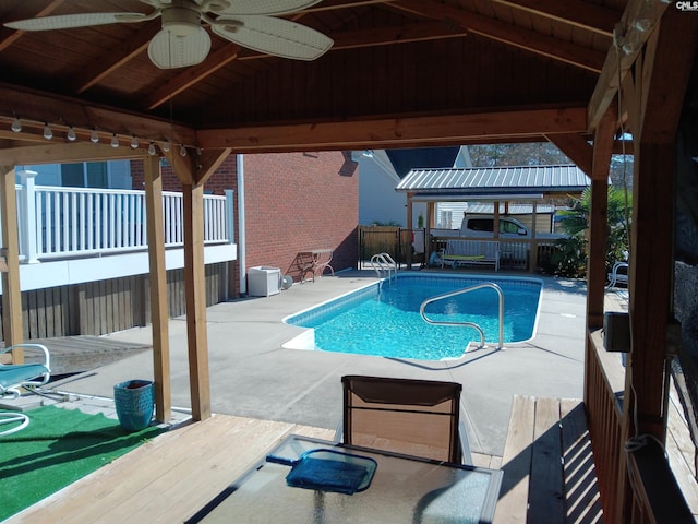 view of pool with a gazebo, a patio area, and ceiling fan