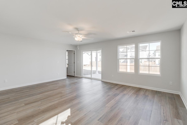 unfurnished room featuring ceiling fan and light hardwood / wood-style floors