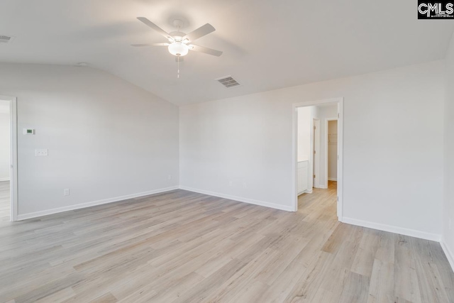 spare room featuring light hardwood / wood-style flooring, ceiling fan, and lofted ceiling