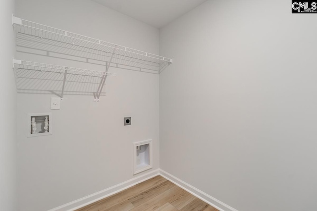 laundry area with hookup for an electric dryer, hardwood / wood-style floors, and hookup for a washing machine