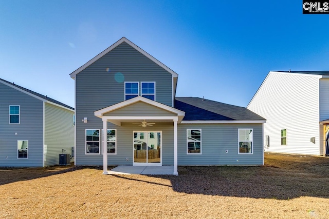 rear view of house featuring a patio area, ceiling fan, a yard, and cooling unit