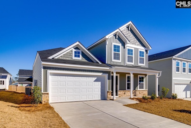 craftsman-style home with a porch and cooling unit