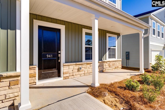 property entrance with covered porch