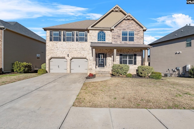 craftsman-style house with a front lawn and a garage