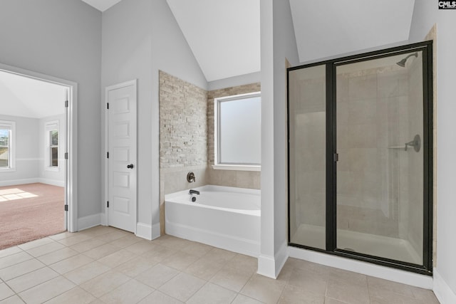 bathroom featuring tile patterned flooring, plus walk in shower, and lofted ceiling