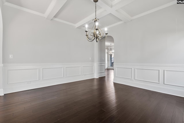 unfurnished dining area featuring dark wood-type flooring, beamed ceiling, a chandelier, and coffered ceiling