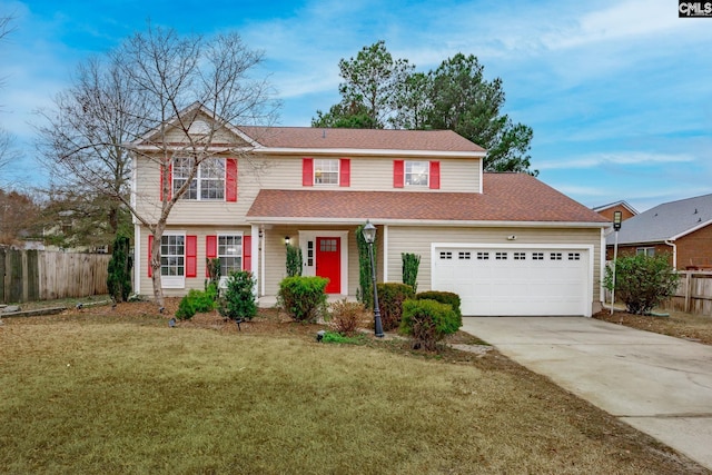 view of front of property with a garage and a front yard