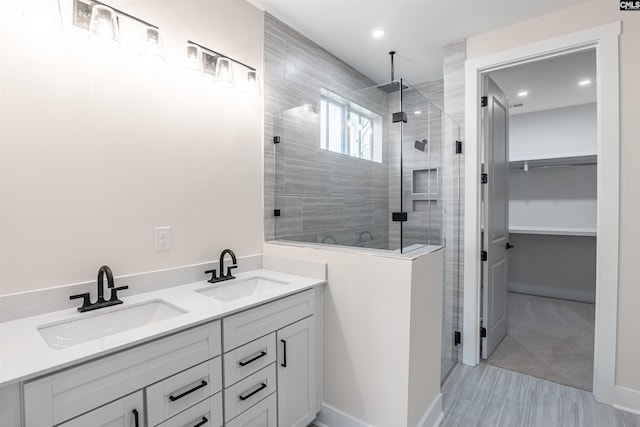 bathroom with vanity and walk in shower