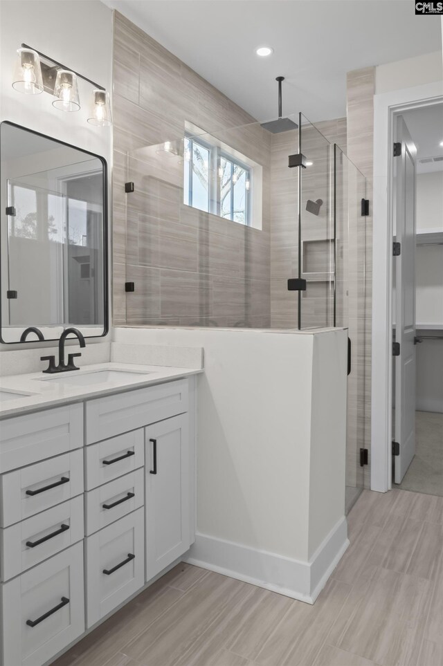 bathroom featuring vanity and walk in shower