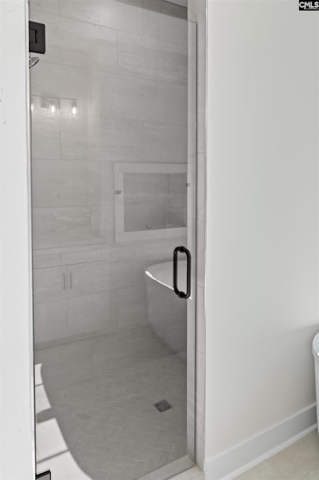 bathroom with an enclosed shower