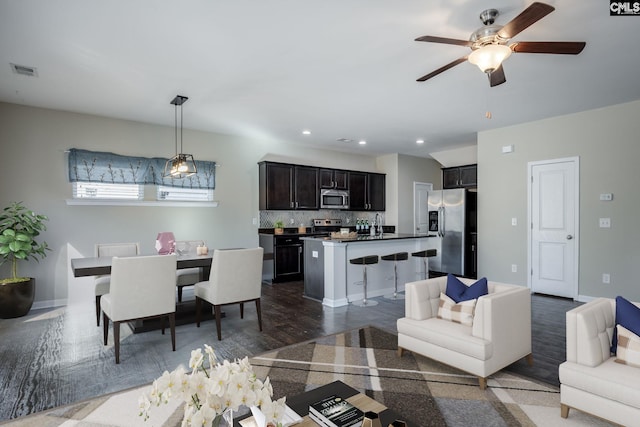 living room featuring ceiling fan