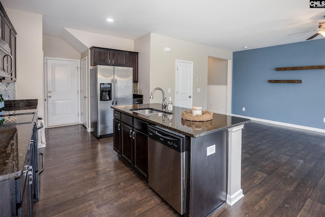 kitchen with a center island with sink, dark hardwood / wood-style flooring, sink, and stainless steel appliances