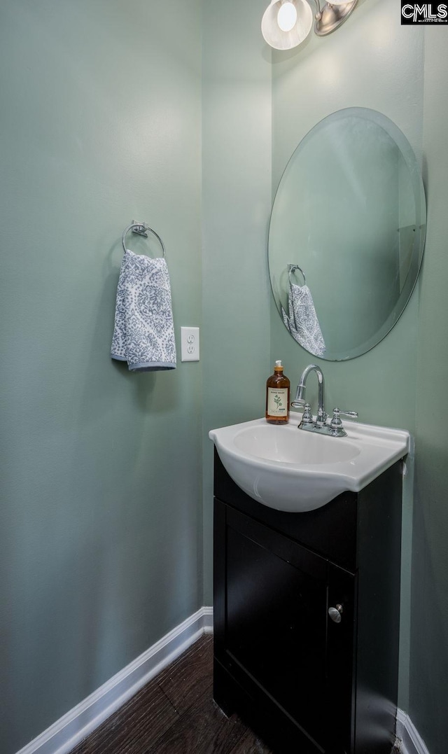 bathroom featuring hardwood / wood-style floors and vanity