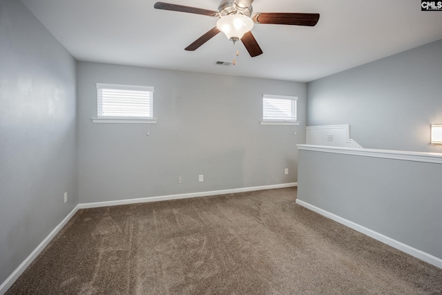 unfurnished room featuring carpet flooring, ceiling fan, and plenty of natural light