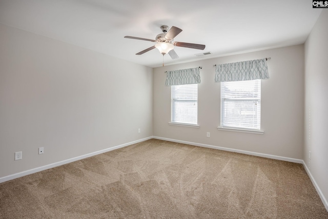 carpeted empty room featuring ceiling fan