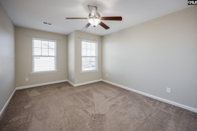 unfurnished room featuring carpet, plenty of natural light, and ceiling fan