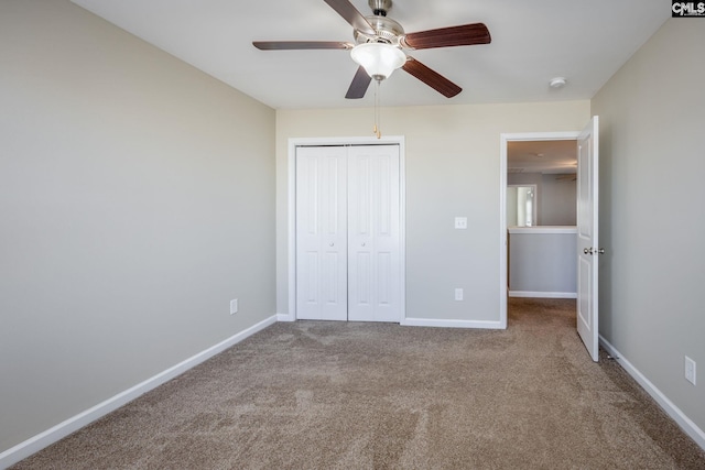 unfurnished bedroom featuring carpet flooring, ceiling fan, and a closet