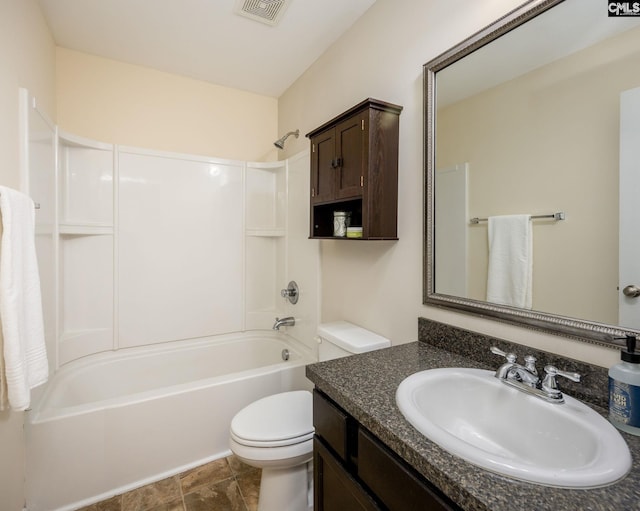 full bathroom featuring shower / bathing tub combination, vanity, and toilet