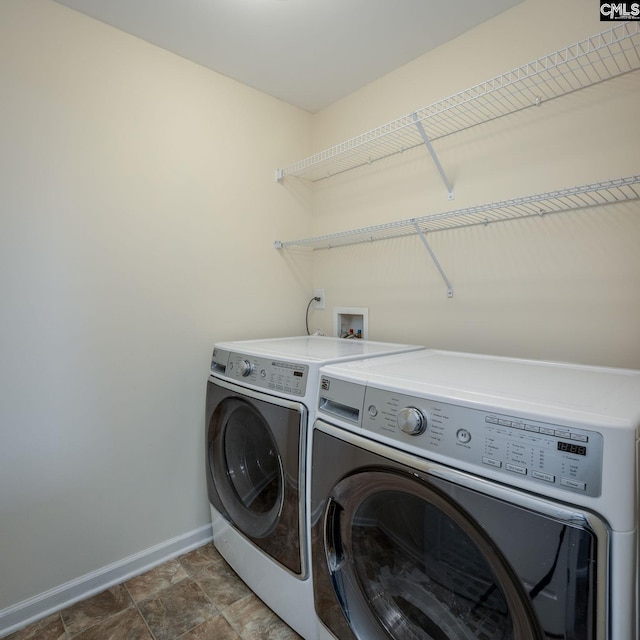 laundry area with independent washer and dryer