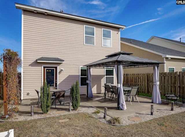 back of house featuring a gazebo and a patio area