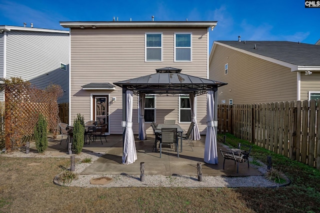 back of house featuring a gazebo and a patio area