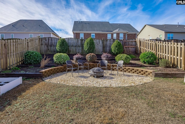 view of yard with a fire pit