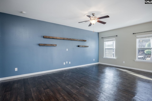 unfurnished room featuring ceiling fan and dark hardwood / wood-style flooring