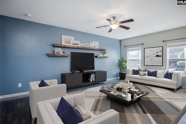 living room with ceiling fan and wood-type flooring