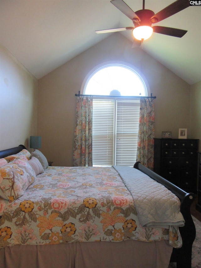 bedroom with ceiling fan and vaulted ceiling