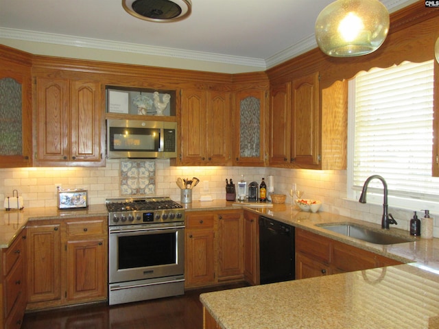 kitchen with stainless steel appliances, tasteful backsplash, crown molding, and sink