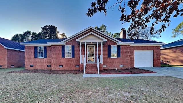 view of front facade with a front yard and a garage