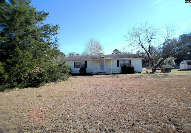 ranch-style house with a shed