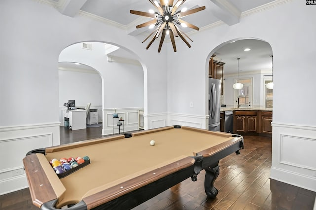 game room featuring beam ceiling, ornamental molding, dark wood-type flooring, and billiards