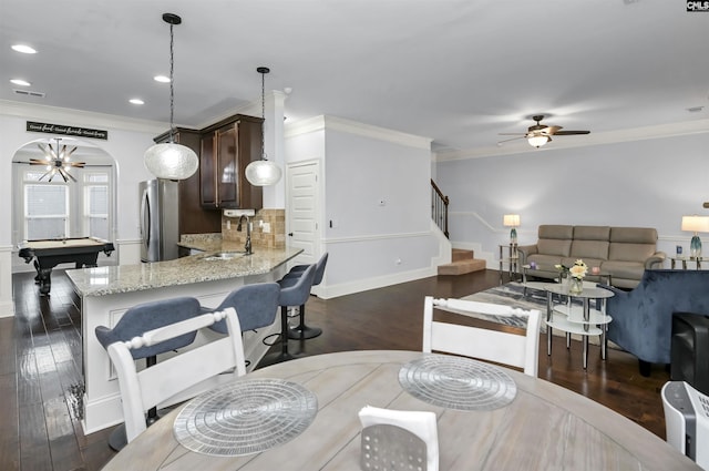 dining area featuring sink, ornamental molding, dark hardwood / wood-style floors, and billiards