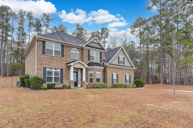 craftsman-style home featuring a front yard